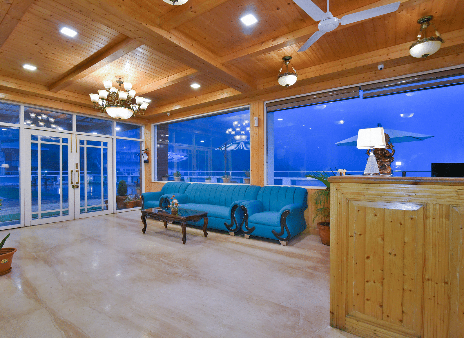 Reception area with a sofa near the reception desk at DLS Highland Resort and Spa, Mussoorie.